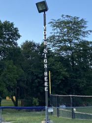 Freedom Field:  East Foul Pole  (Facing Home Plate; Vertical Lettering)