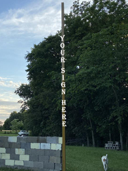 Montesquieu Field: Foul Poles  (Facing Home Plate; Vertical Lettering)