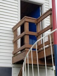 Staining of landing deck of spiral staircase at press box - $50 Value